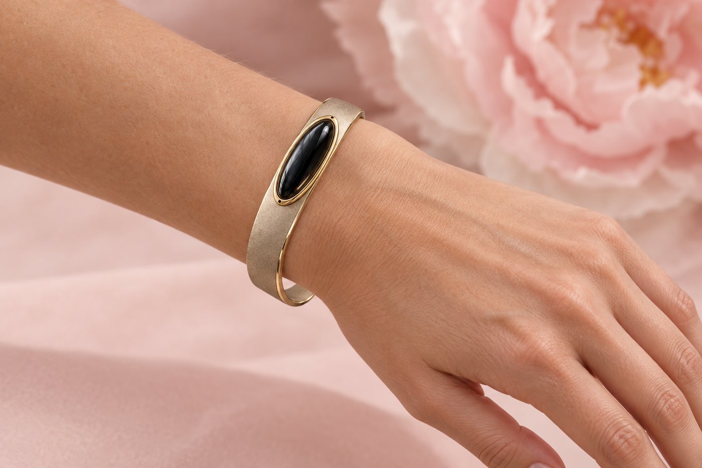 Render of the cuff worn on a woman's wrist